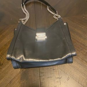 Black and silver MK bag